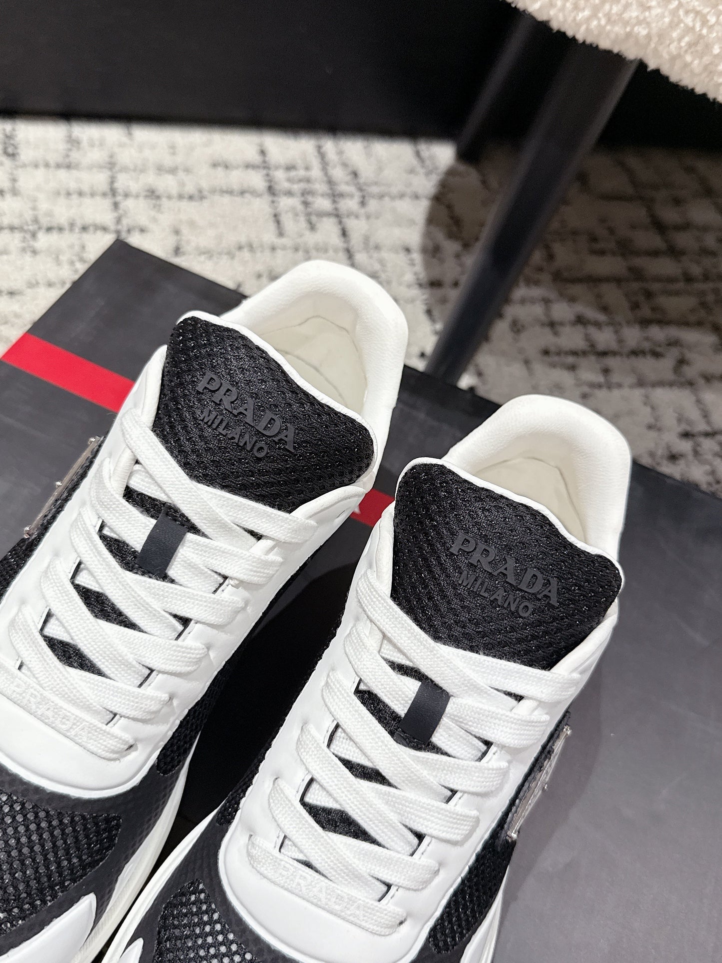 PRADA 25S MEN SNEAKERS IN BLACK AND WHITE CANVAS