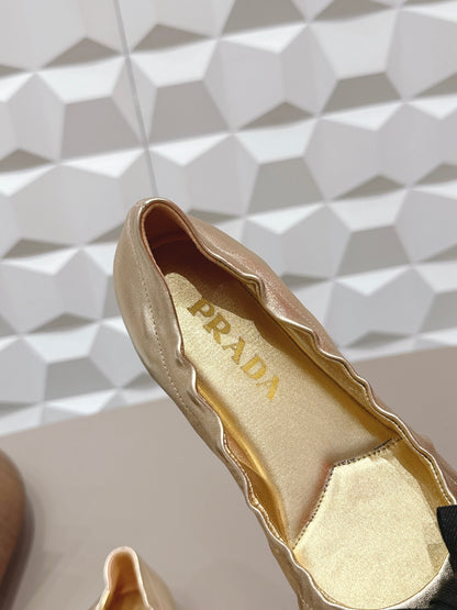 PRADA 26S ROUND TOE FLATS WITH BOW IN GOLD CALFSKIN