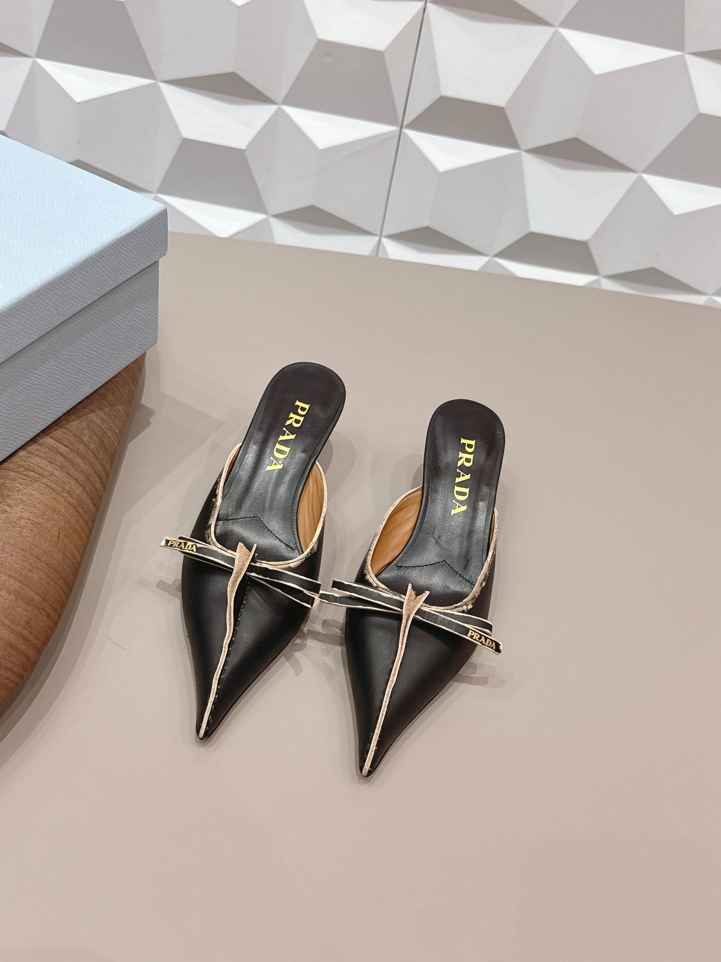 PRADA 26S POINTED TOE LACE TRIM MULES 55MM IN BLACK CALFSKIN WITH BOW