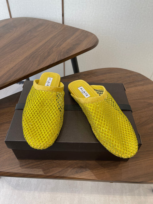 ALAIA 26S FLAT MULES IN DARK YELLOW SUEDE AND MESH RHINESTONE-EMBELLISHED