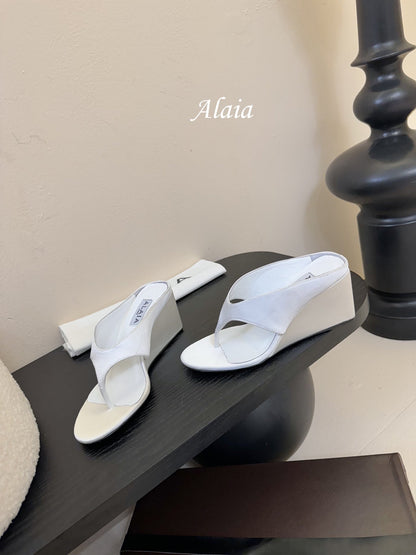 ALAIA WEDGE THONG SANDALS 25S IN WHITE SATIN