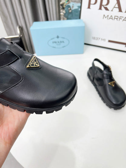 PRADA 26S RUBBER LOGO CHUNKY SOLE FISHERMAN SANDALS IN BLACK CALFSKIN