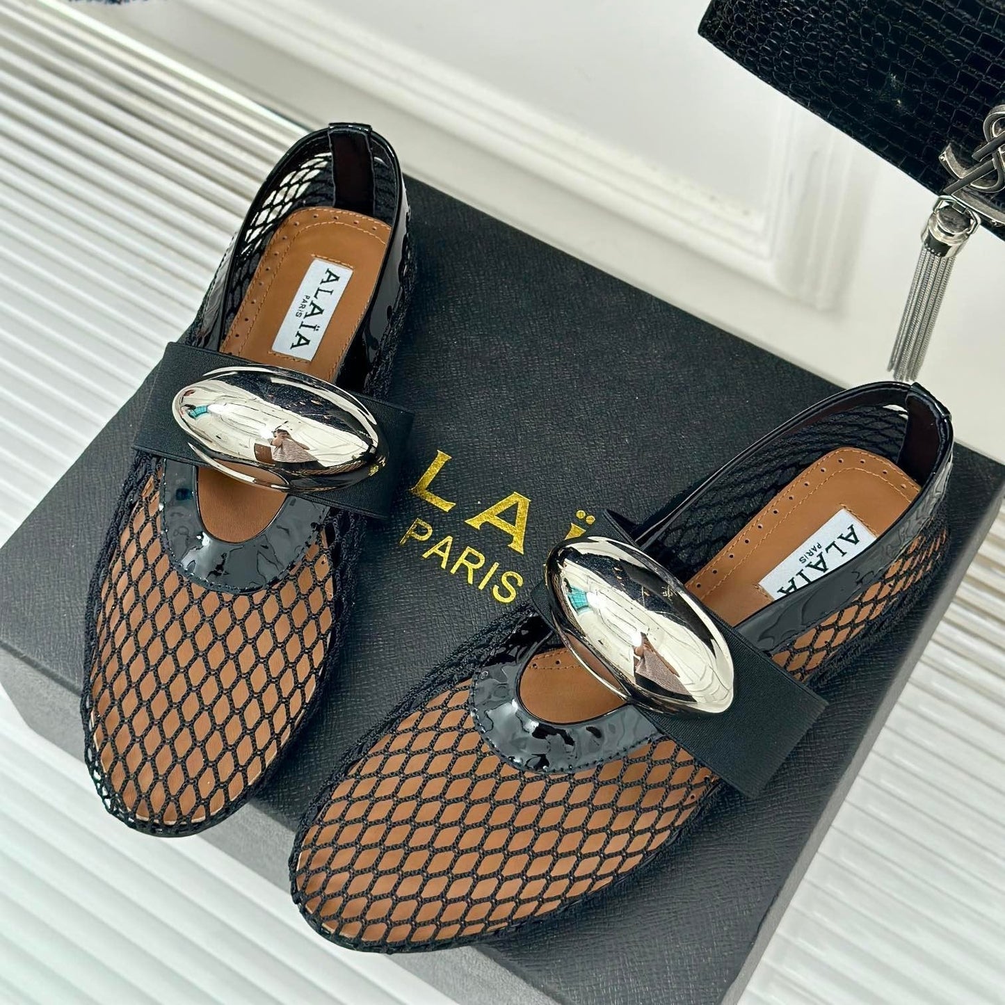 ALAIA MARY JANE SHOES IN BLACK MESH WITH SILVER HARDWARE
