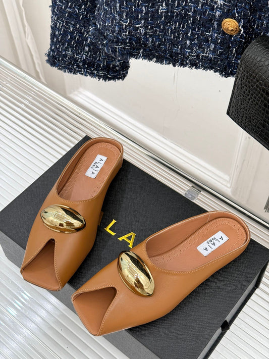 ALAIA FLAT MULE IN BRONZE BROWN LAMBSKIN WITH GOLD HARDWARE