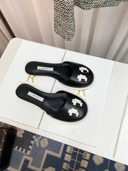 THE ROW 26S PIXEL APPLIQUE MULES IN BLACK CALFSKIN