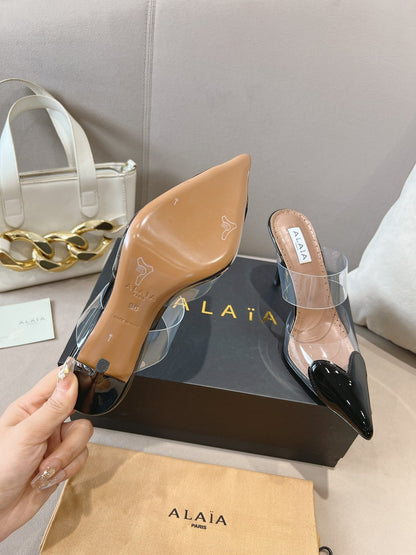 ALAIA HIGH MULES IN BLACK PATENT CALFSKIN AND FILM