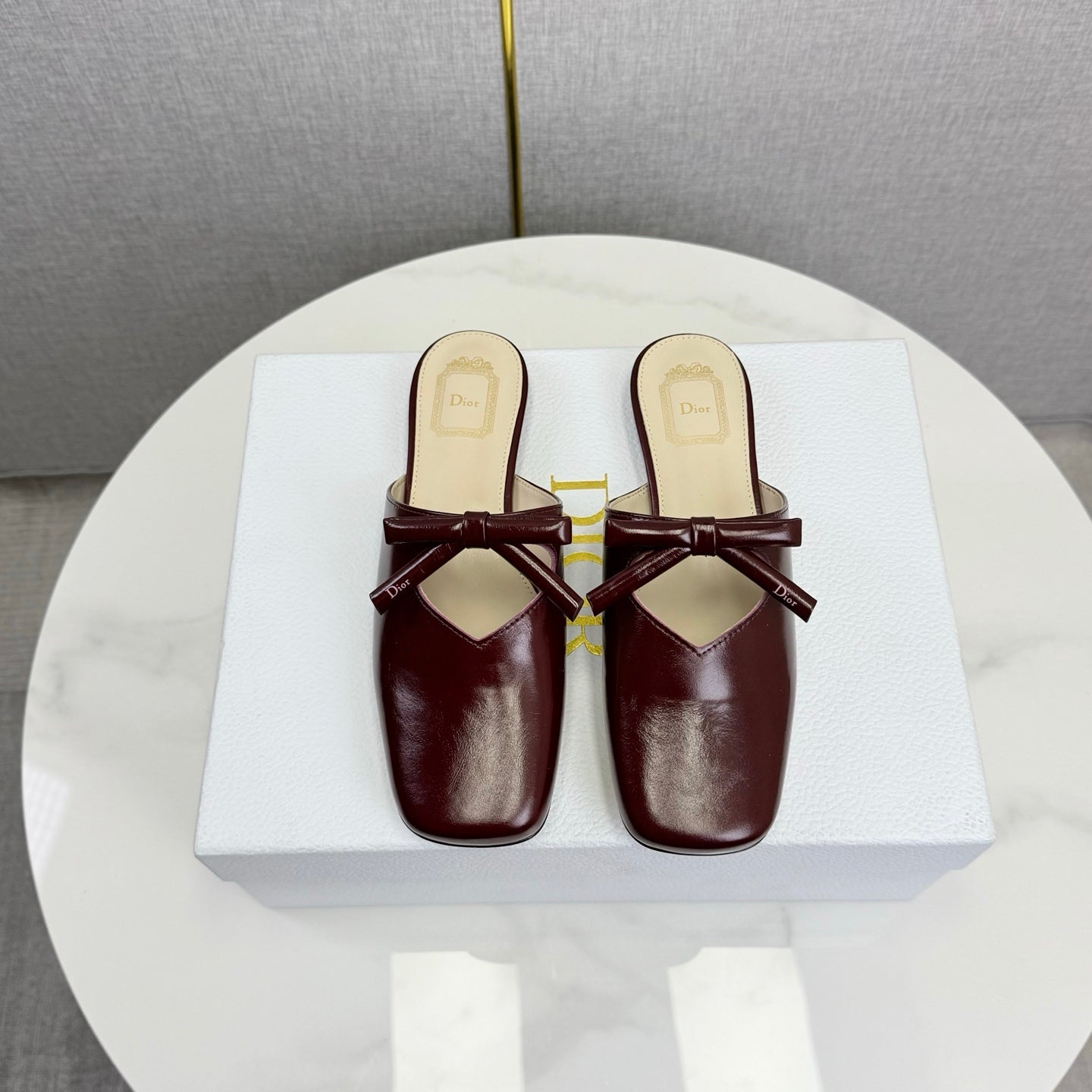DIOR 26S PEARL-ACCENT BOW FLAT MULES IN DARK RED GLOSSY CALFSKIN