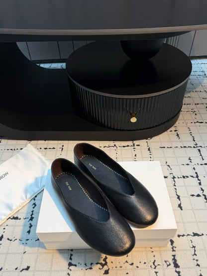 THE ROW 26S CLASSIC BALLET FLATS IN BLACK CALFSKIN