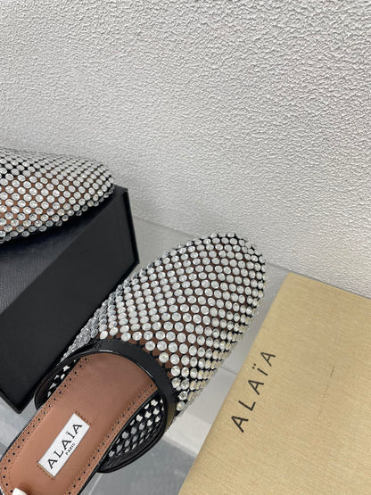ALAIA FLAT MULES IN STRASS BLACK LAMBSKIN WITH RHINSTONES