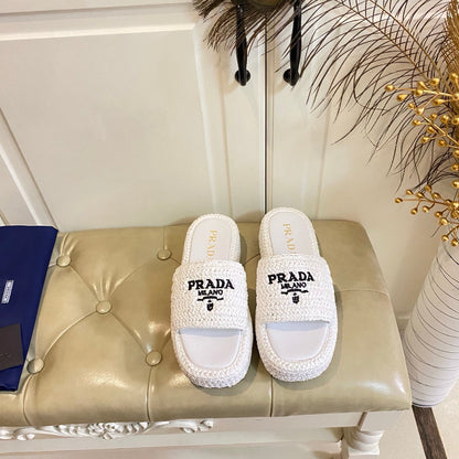 PRADA 26S SLIDE SANDALS IN WHITE LOGO RAFFIA