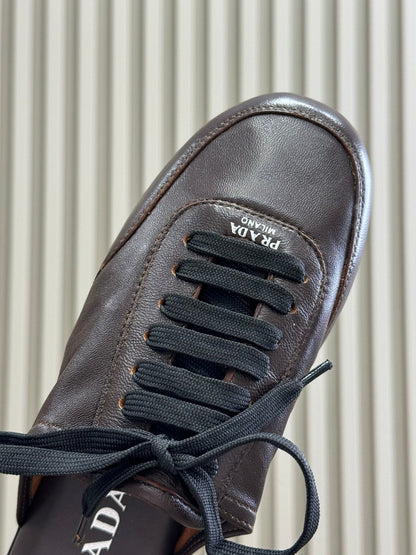 PRADA 25S COLLAPSE FLAT SHOES IN DARK BROWN CALFSKIN