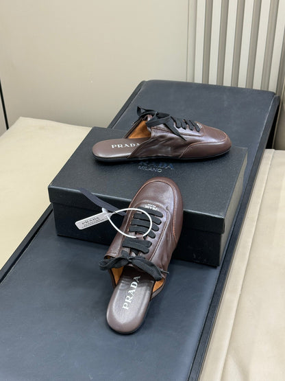 PRADA 25S COLLAPSE MULES IN DARK BROWN CALFSKIN