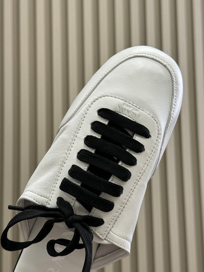 PRADA 25S COLLAPSE MULES IN WHITE CALFSKIN