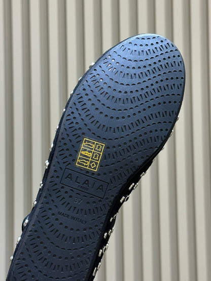 ALAIA 26S CROSS-STRAP FLATS IN BLACK SUEDE WITH SILVER HARDWARE