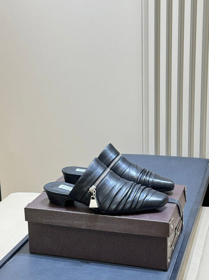 ALAIA 26S PLEATED MULES IN BLACK LAMBSKIN