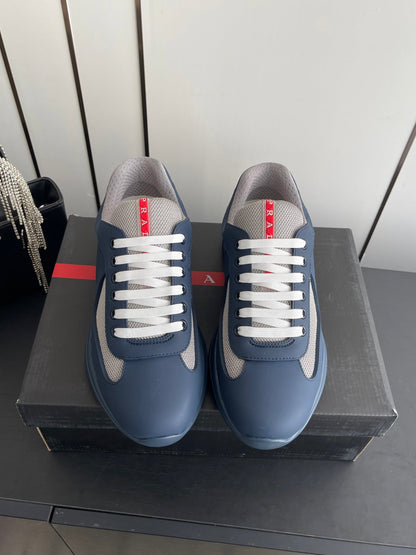 PRADA 26S AMERICA CUP SNEAKERS IN SLATE BLUE SOFT RUBBER AND BIKE FABRIC