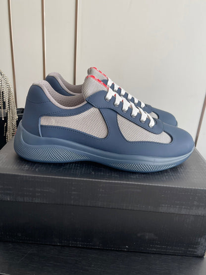 PRADA 26S AMERICA CUP SNEAKERS IN SLATE BLUE SOFT RUBBER AND BIKE FABRIC
