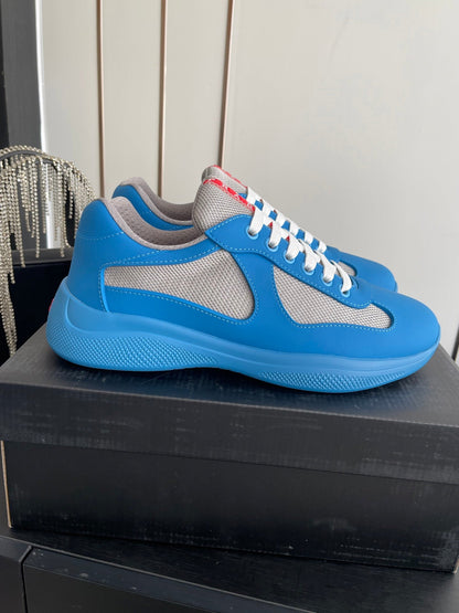PRADA 26S AMERICA CUP SNEAKERS IN AZURE BLUE SOFT RUBBER AND BIKE FABRIC