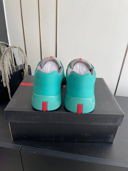 PRADA 26S AMERICA CUP SNEAKERS IN TEAL BLUE SOFT RUBBER AND BIKE FABRIC