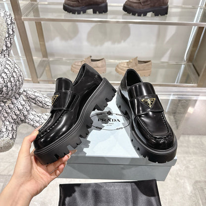 PRADA 25S THICK-SOLE LOAFERS 60 MM IN BLACK CALFSKIN