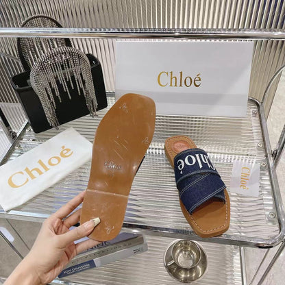 CHLOÉ WOODY MULE IN NAVY BLUE DENIM WITH WHITE LOGO