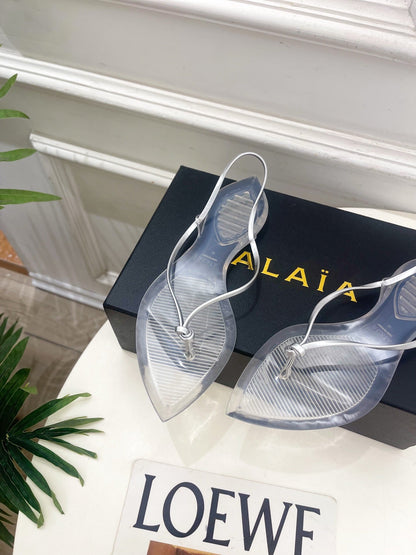 ALAIA 26S POINTED-TOE THONG SANDALS IN SILVER AND TRANSPARENT PVC